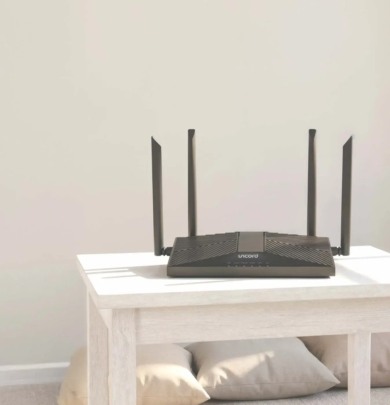 An Uncord router on a table in a living room
